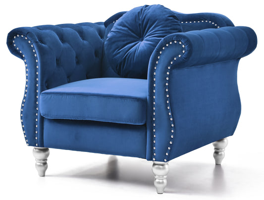 Deep blue velvet armchair with tufted back and silver nailhead trim