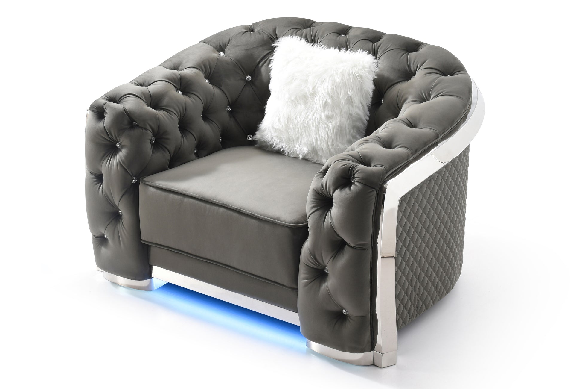 Grey tufted velvet armchair with diamondcut crystal accents and a plush white pillow
