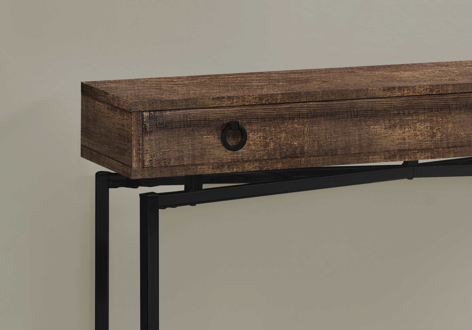 Rustic brown wooden console table with black metal legs and one drawer with a ring pull