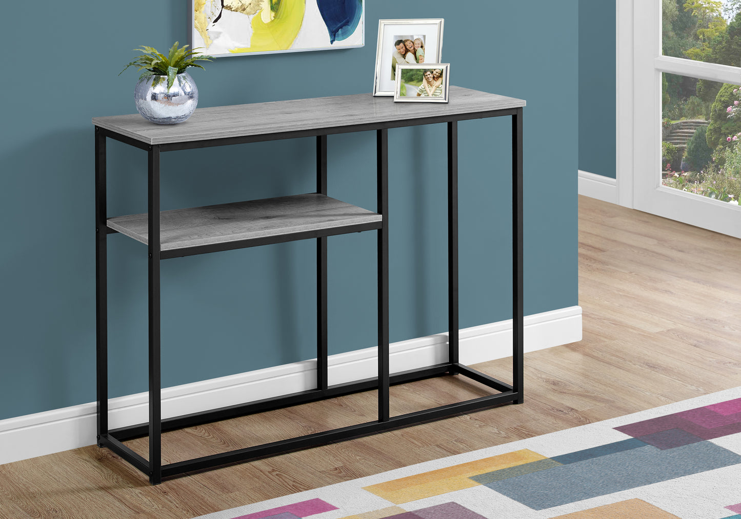 Gray wood finish console table with black metal frame and one shelf