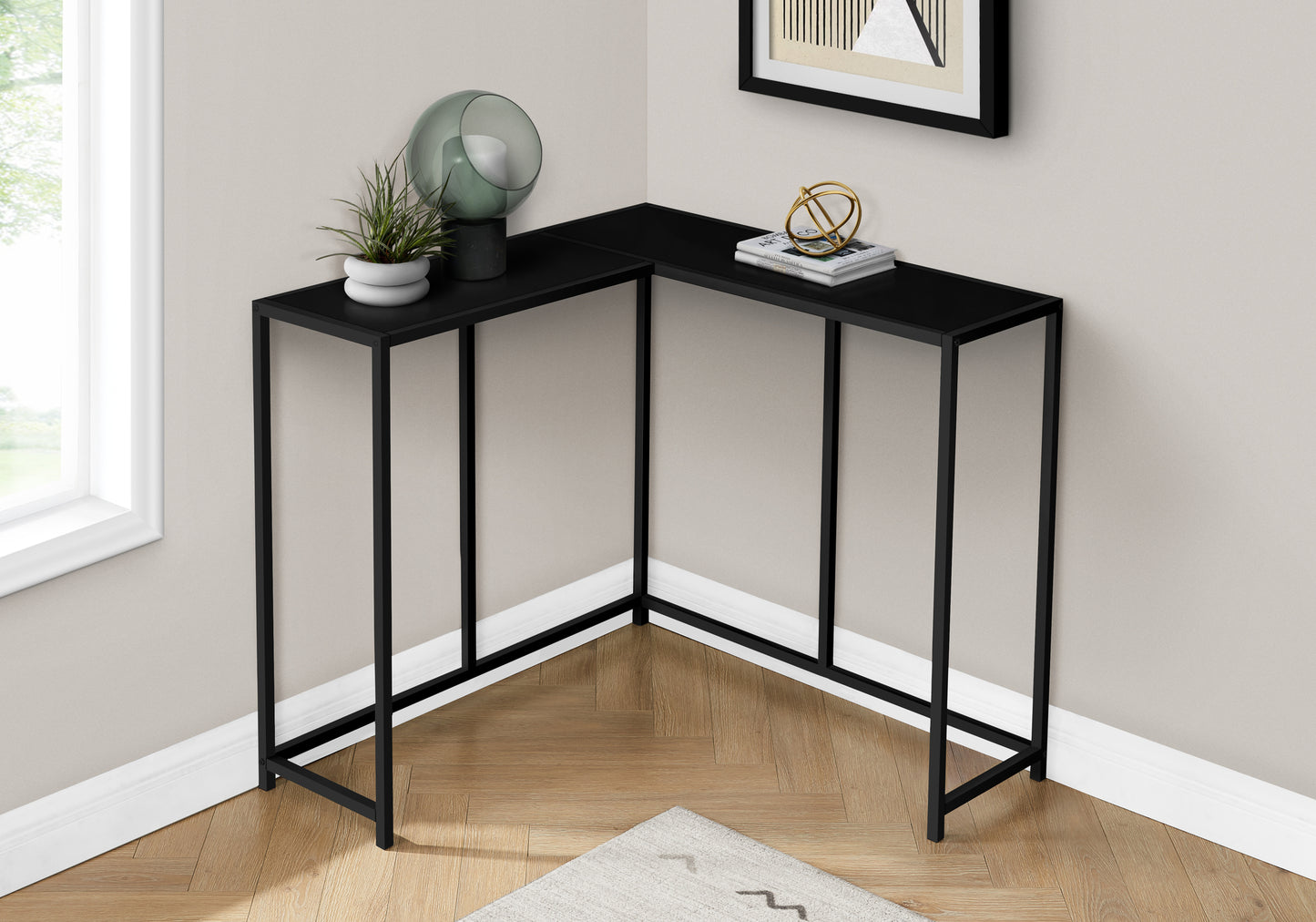 Modern black metal corner console table with a sleek minimalist design for small spaces