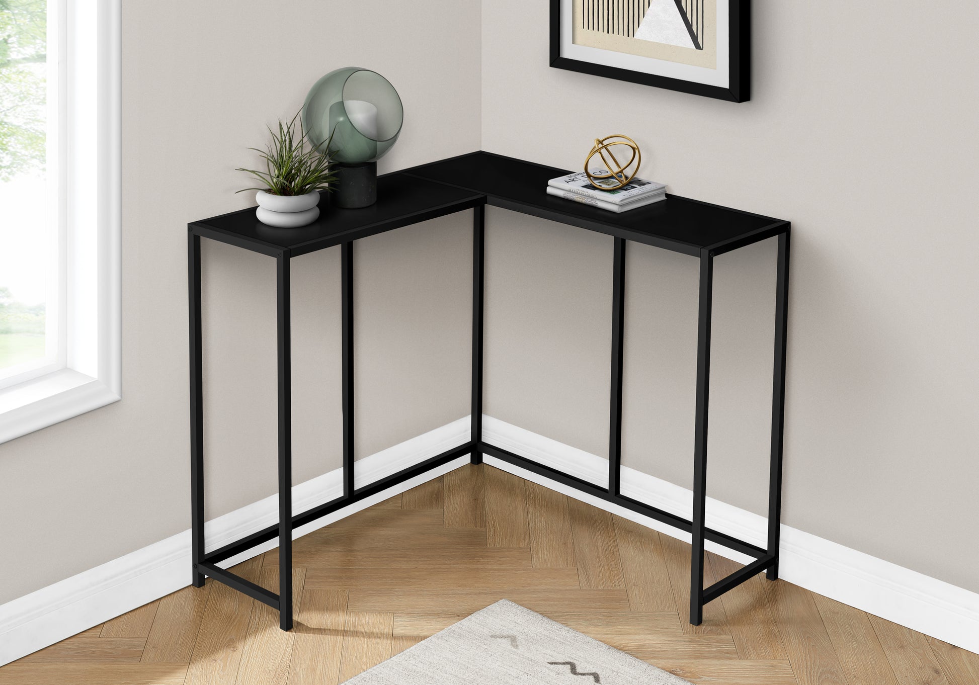 Modern black metal corner console table with a sleek minimalist design for small spaces