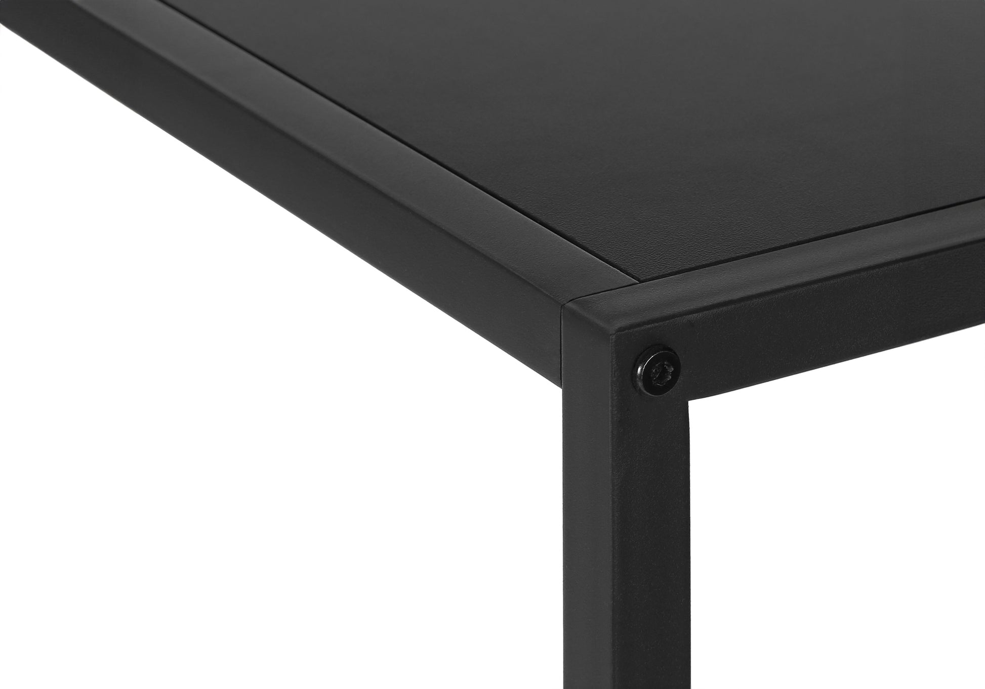 Closeup of a black metal shelf corner with visible screw detail