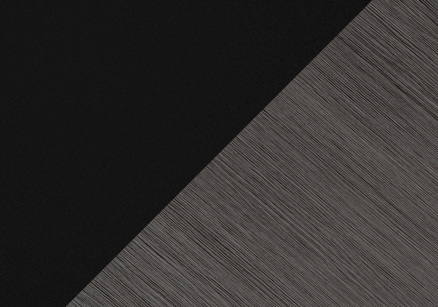 Textured black fabric panel with diagonal brushed metal accent