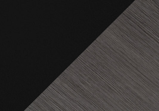Textured black fabric panel with diagonal brushed metal accent