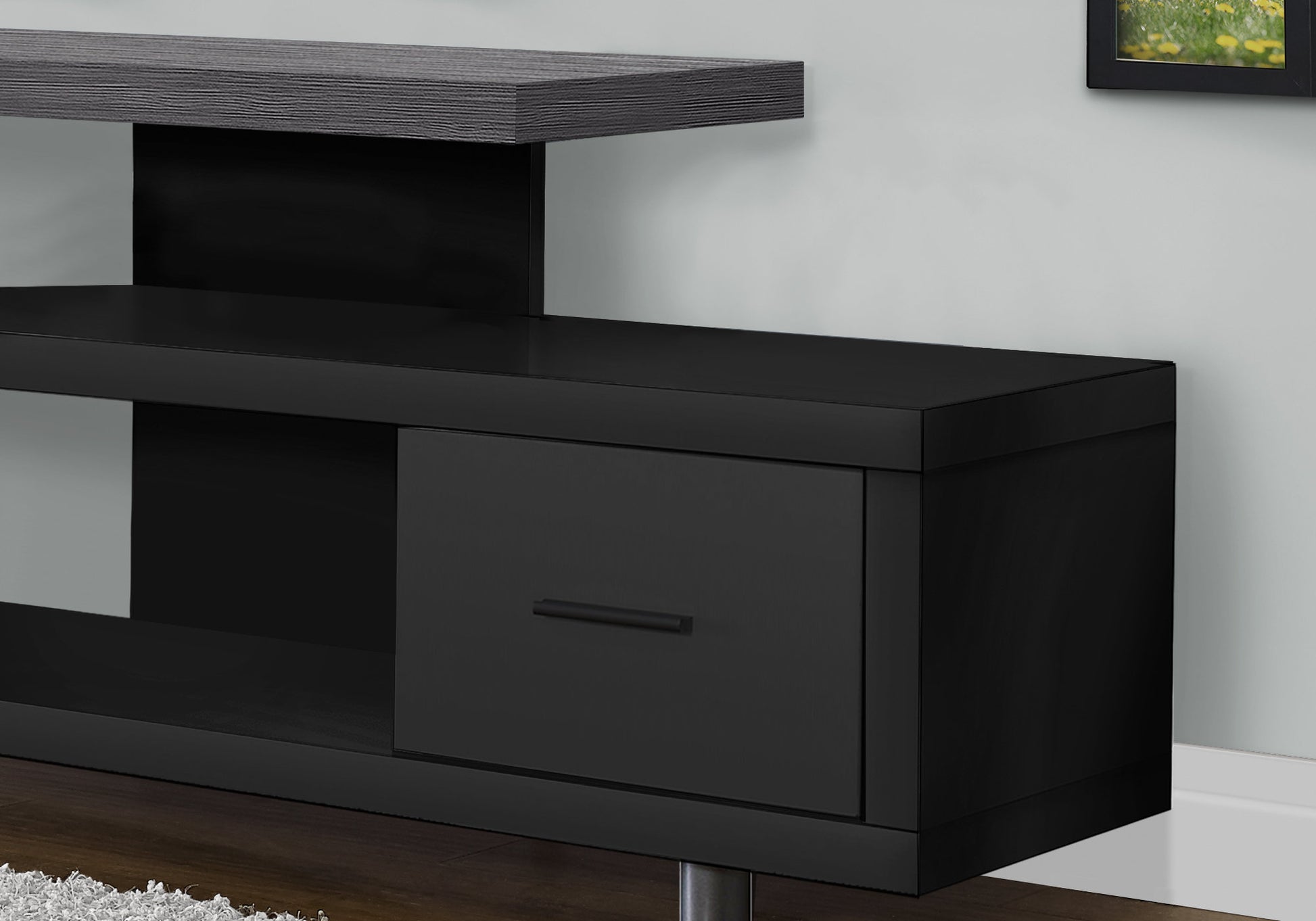 Sleek black media console with a matte finish and woodeffect top shelf