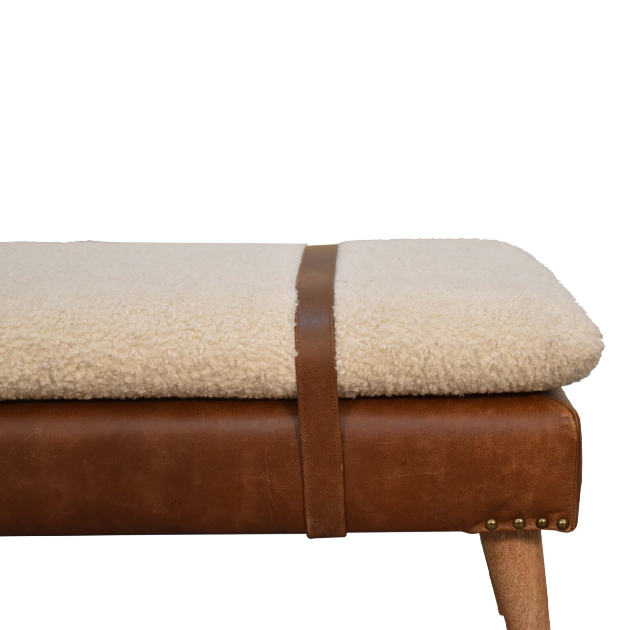 Cream sherpa bench with brown leather base and strap detail