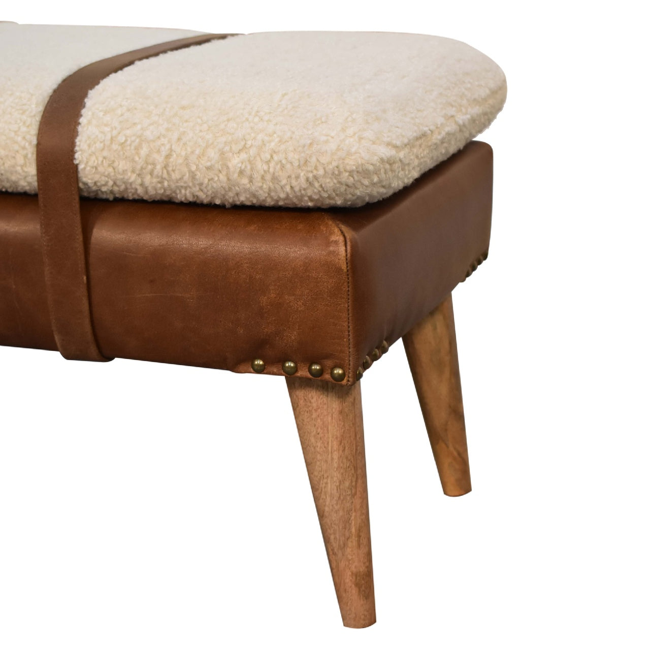Brown leather bench with fluffy cream cushion and leather strap