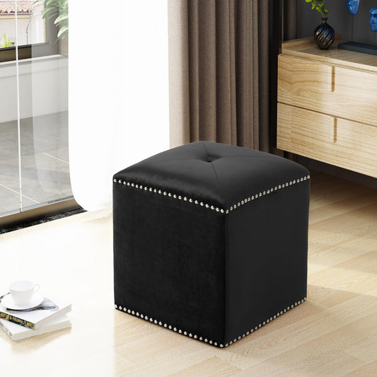 Black velvet ottoman with silver nailhead trim and tufted top