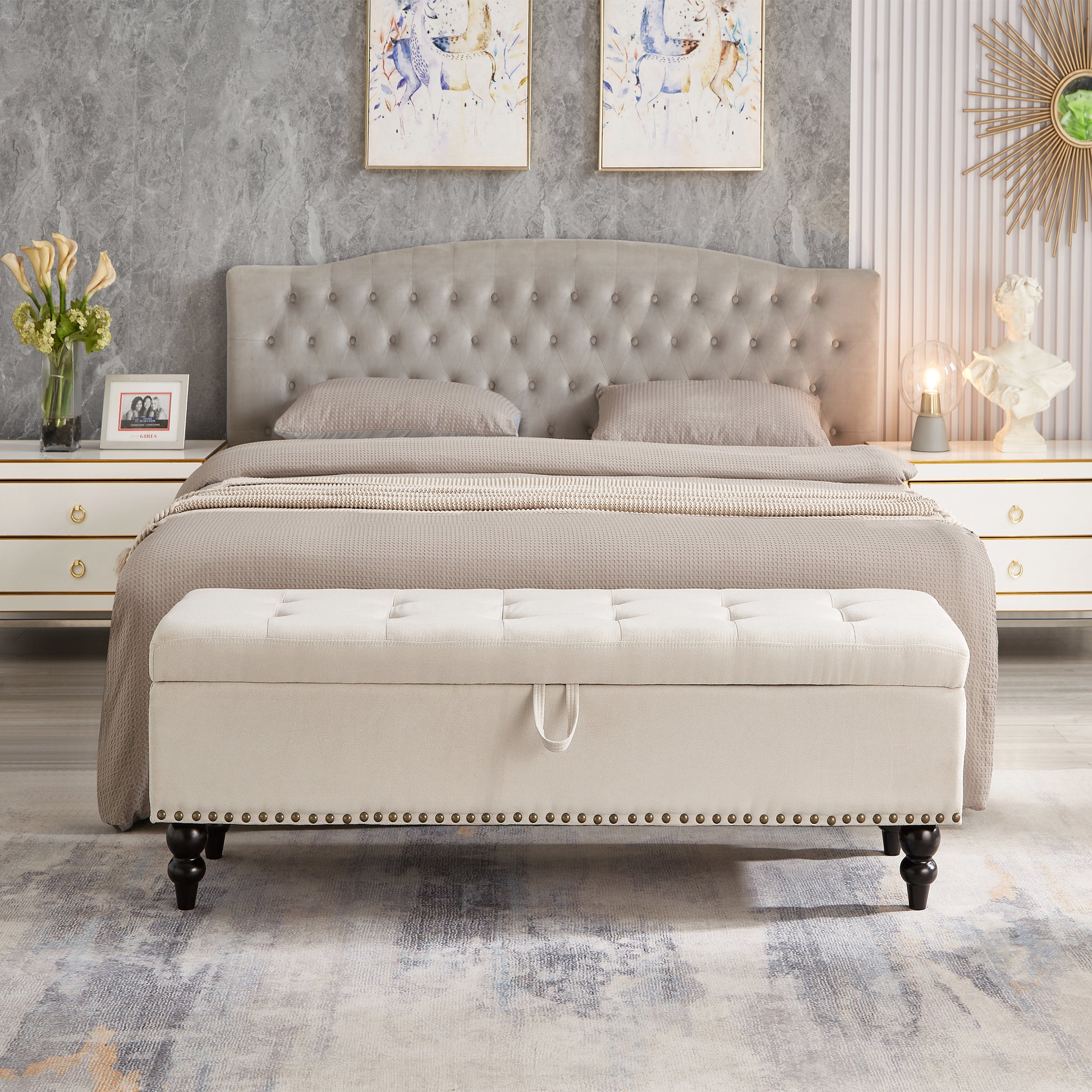 Beige tufted storage bench with nailhead trim and dark wooden legs