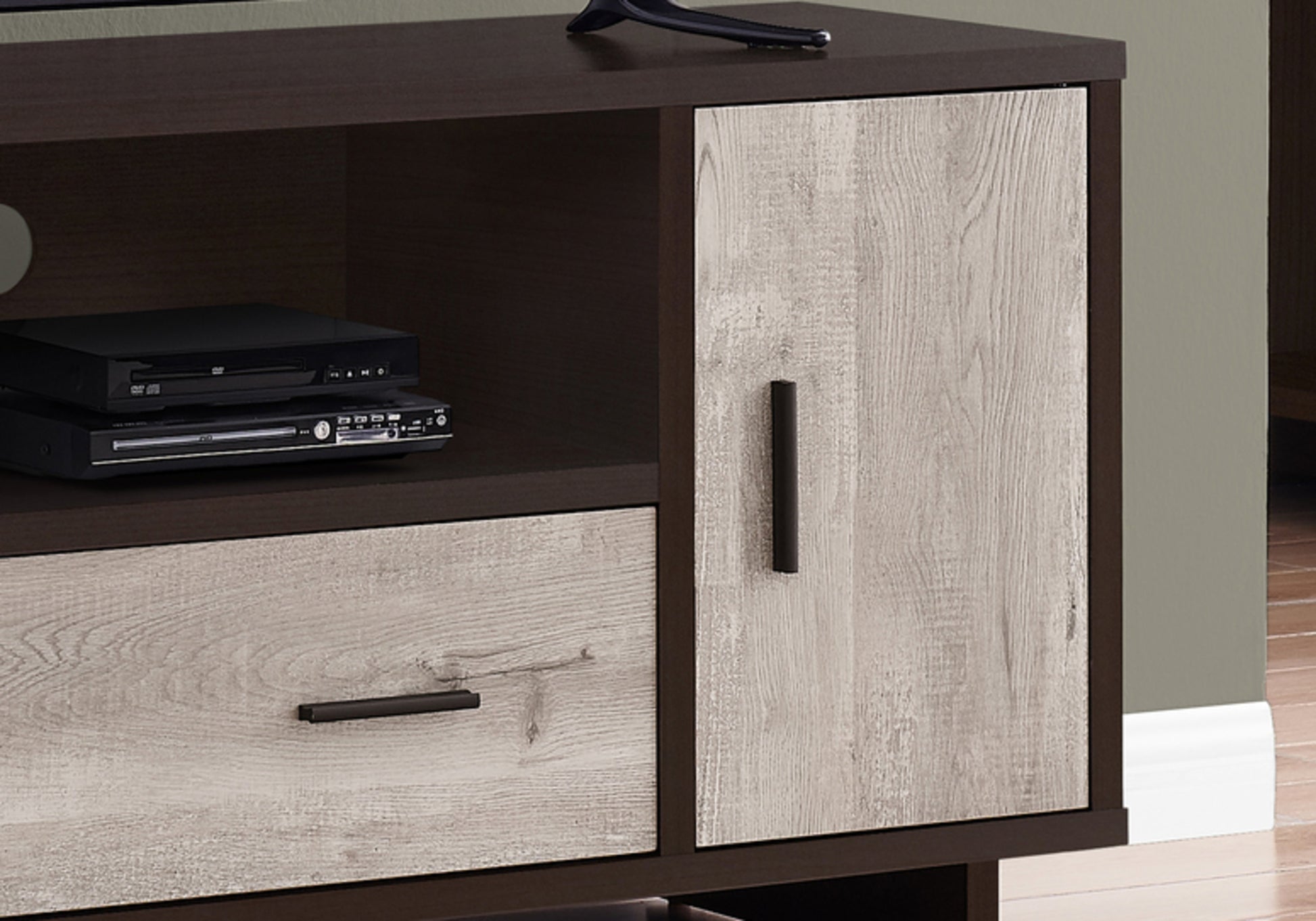 Dark wood media console with weathered oak drawer and cabinet door