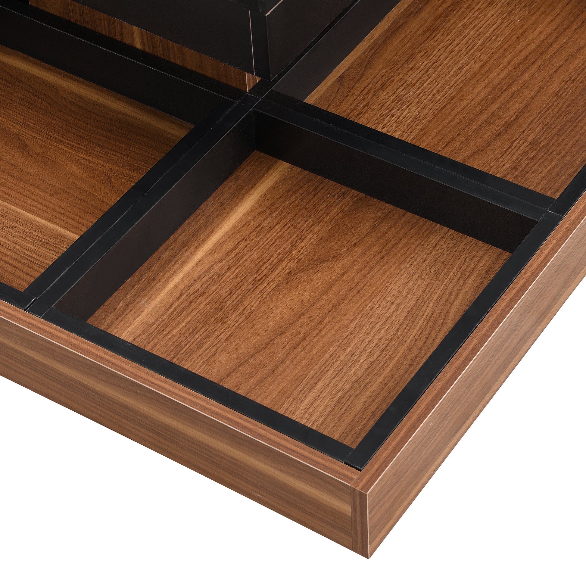 Close up of walnut wood grain on drawer interior with black metal dividers