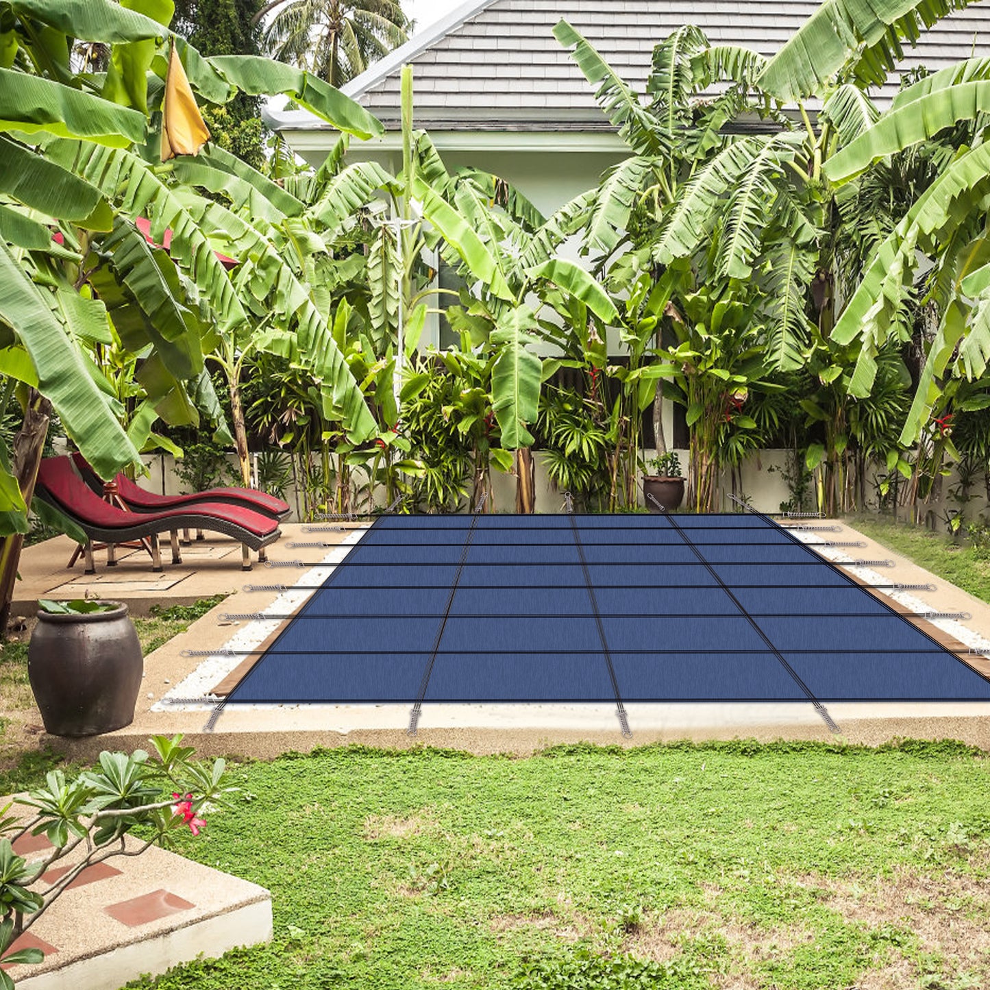 Durable blue solar pool cover with reinforced stitching secures a rectangular pool reducing evaporation