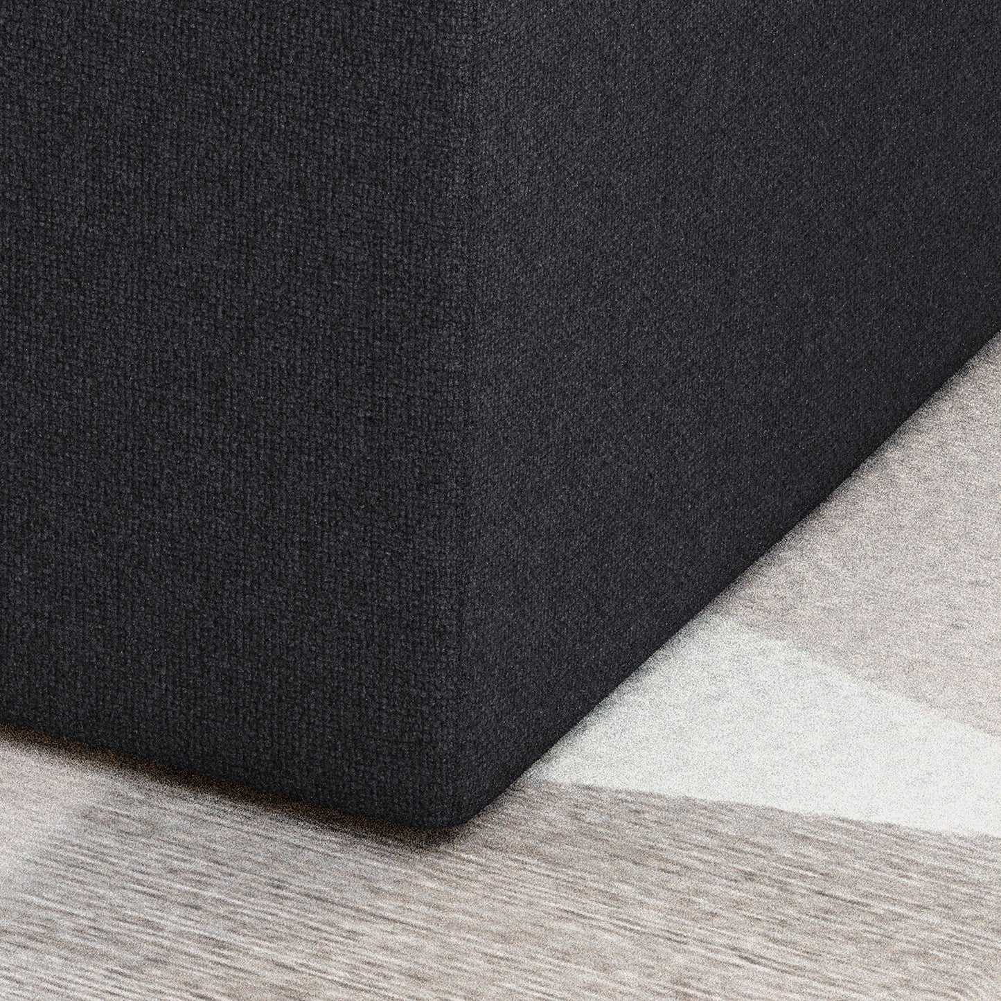 Charcoal grey textured throw pillow corner