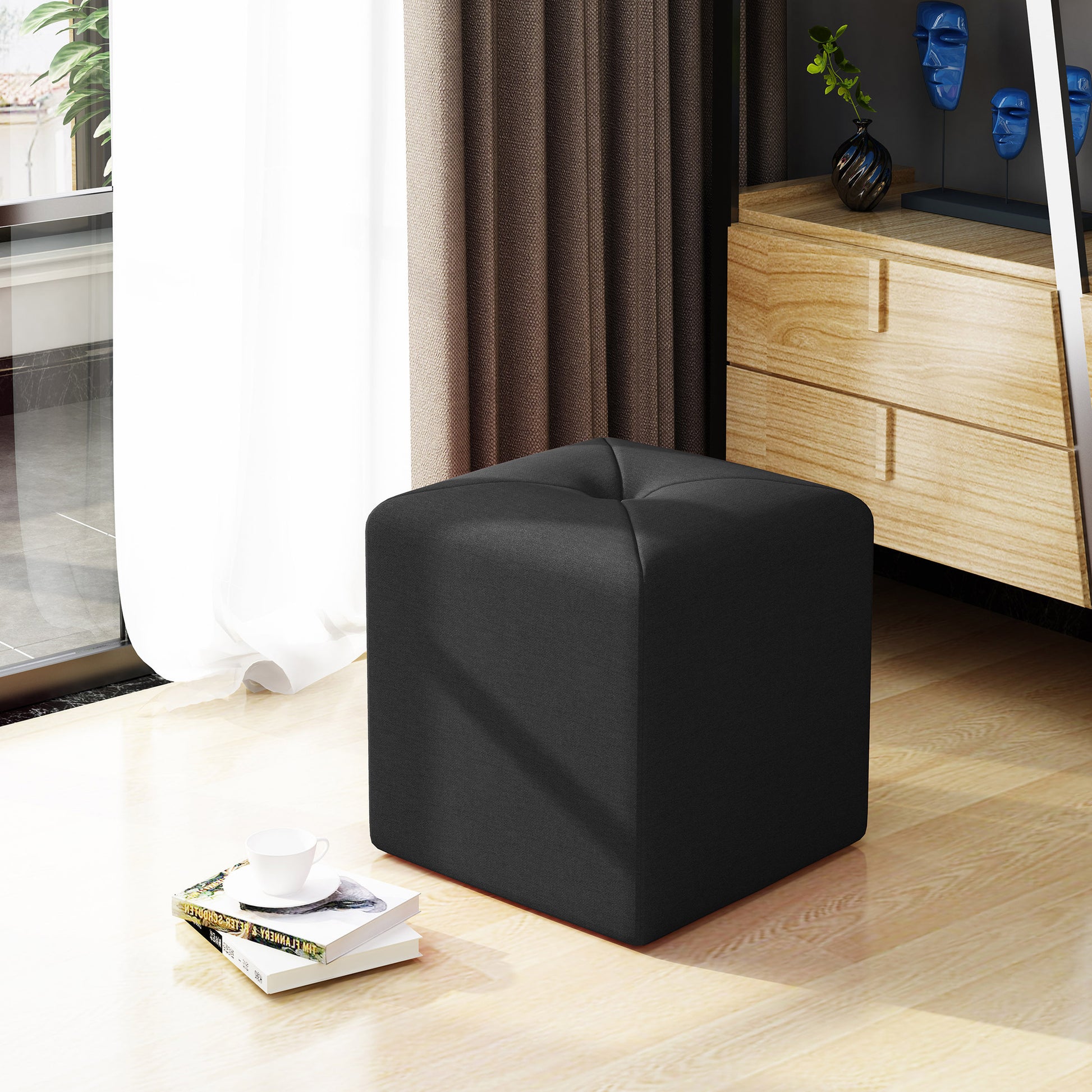 Black fabric storage ottoman with tufted top