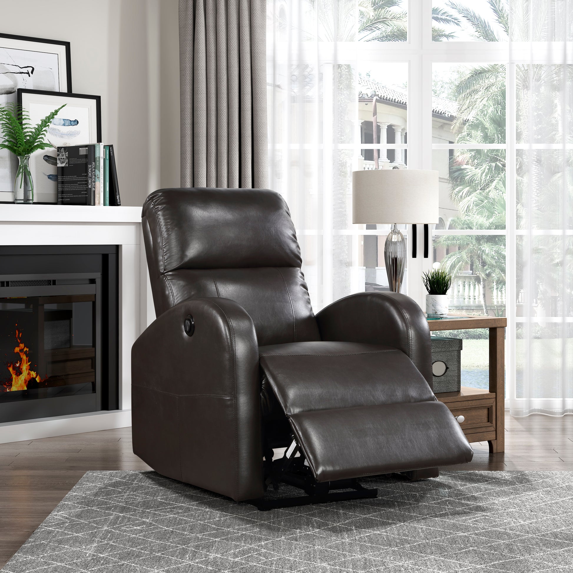 Dark brown leather recliner chair with extended footrest on a grey patterned rug