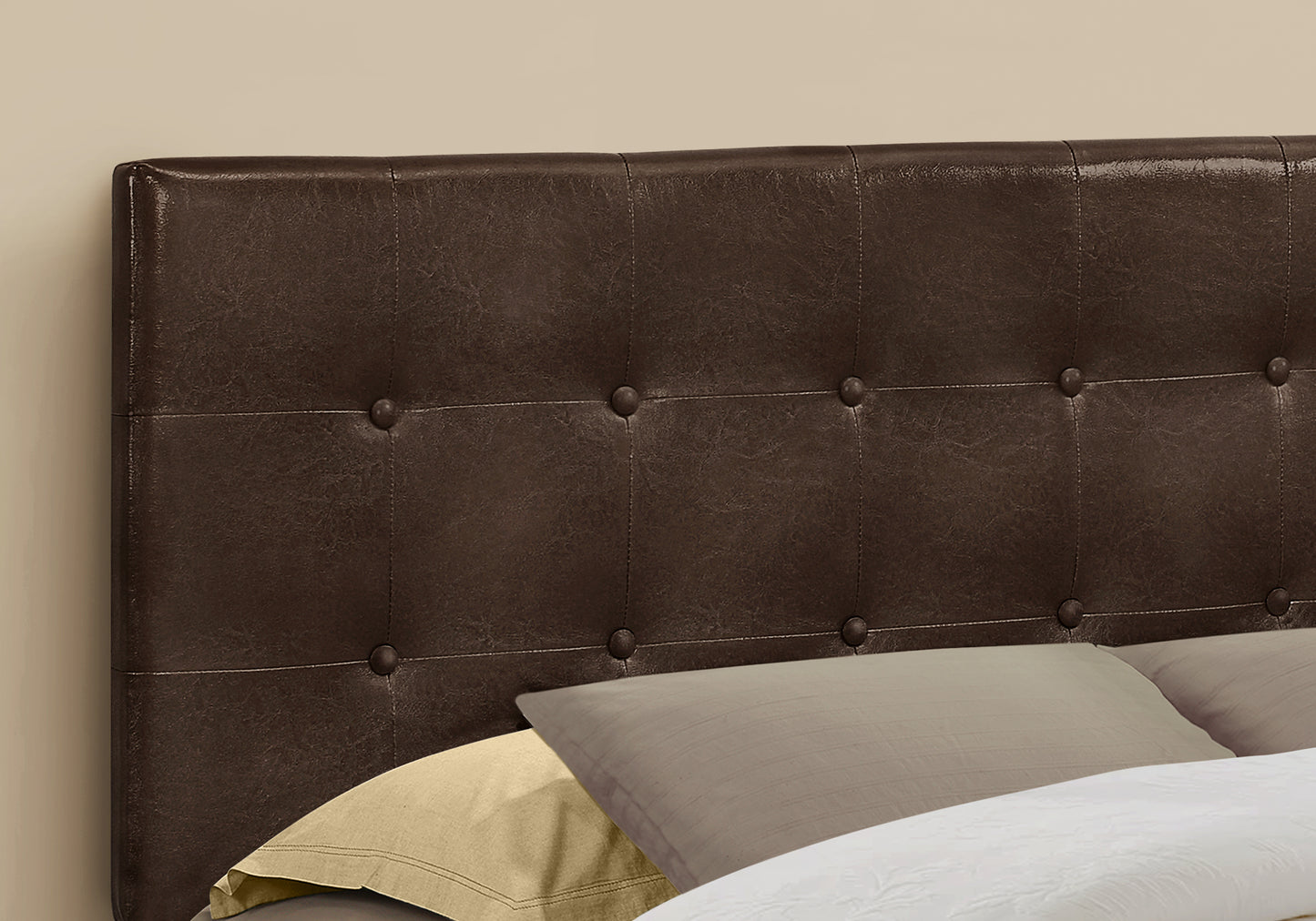 Dark brown faux leather tufted headboard with classic button details