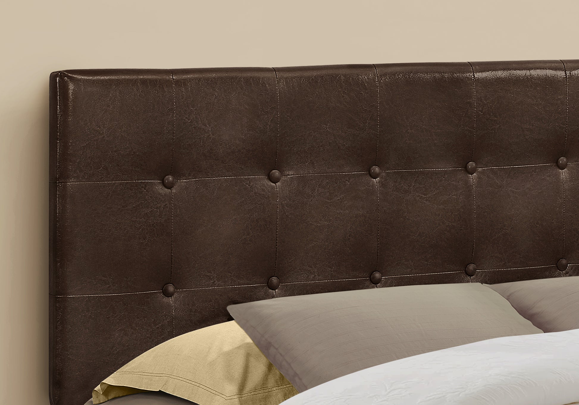 Dark brown faux leather tufted headboard with classic button details