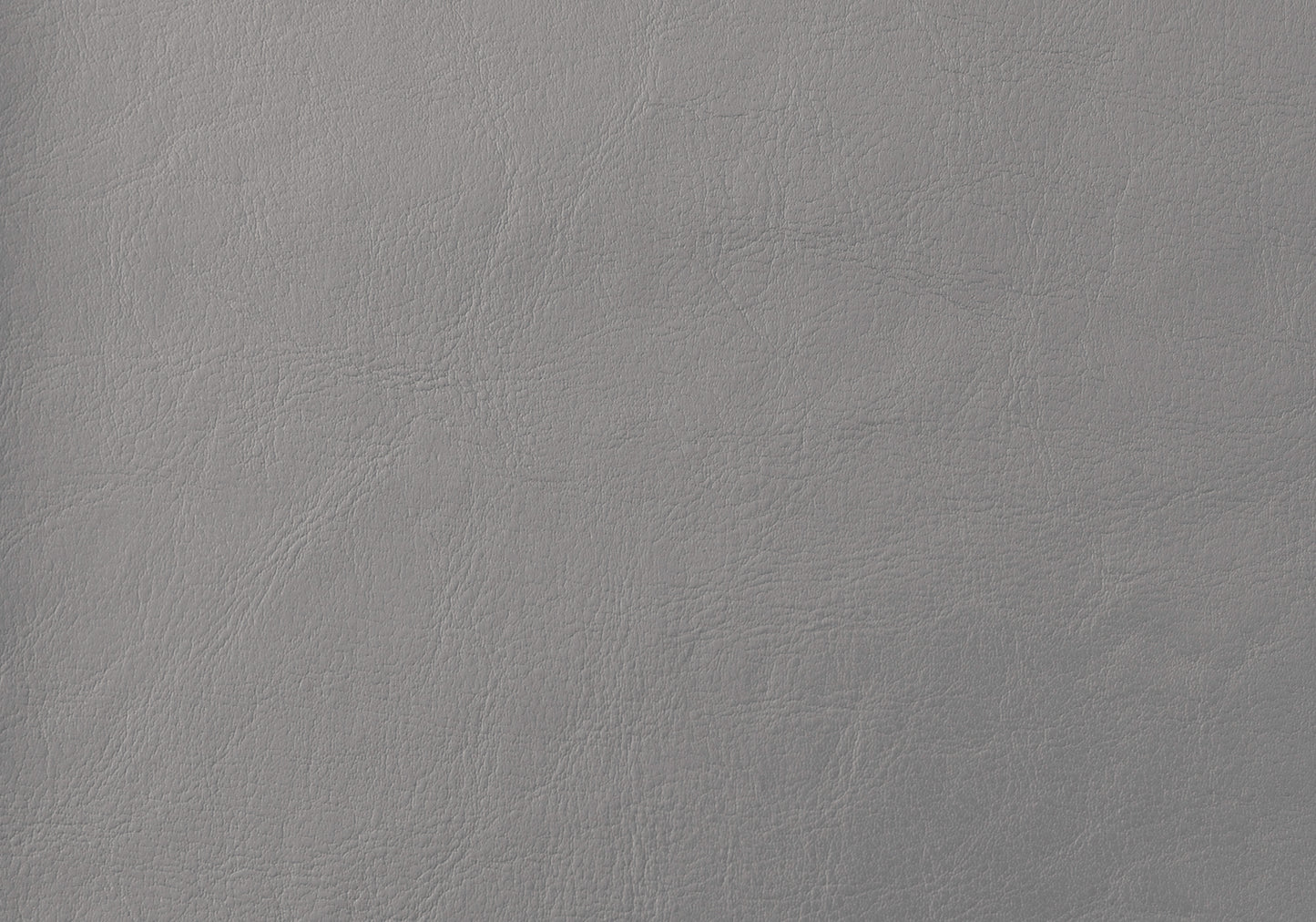 Closeup of textured grey vegan leather swatch with subtle grain for upholstery
