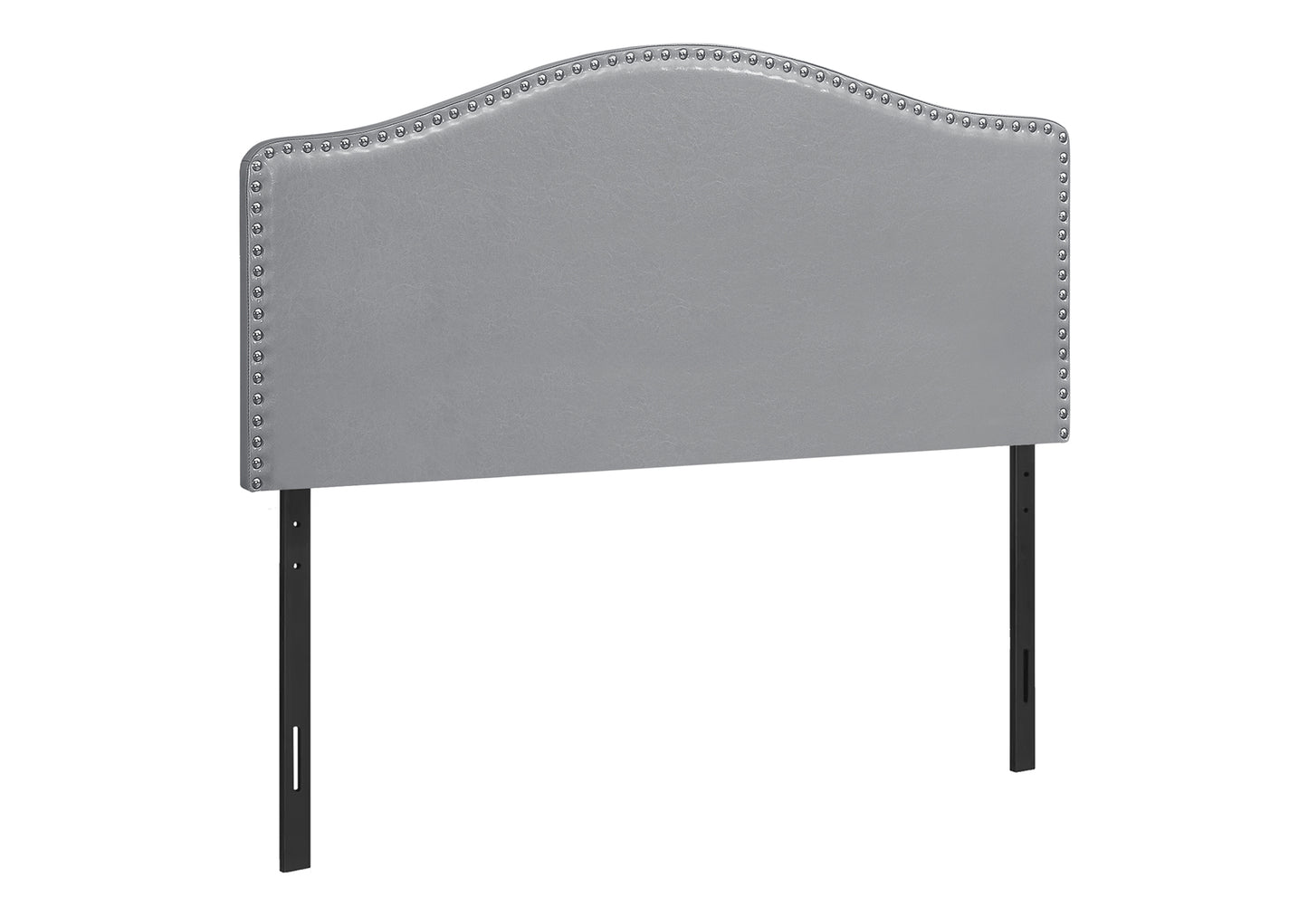 Grey faux leather arched headboard with silver nailhead trim and black metal legs