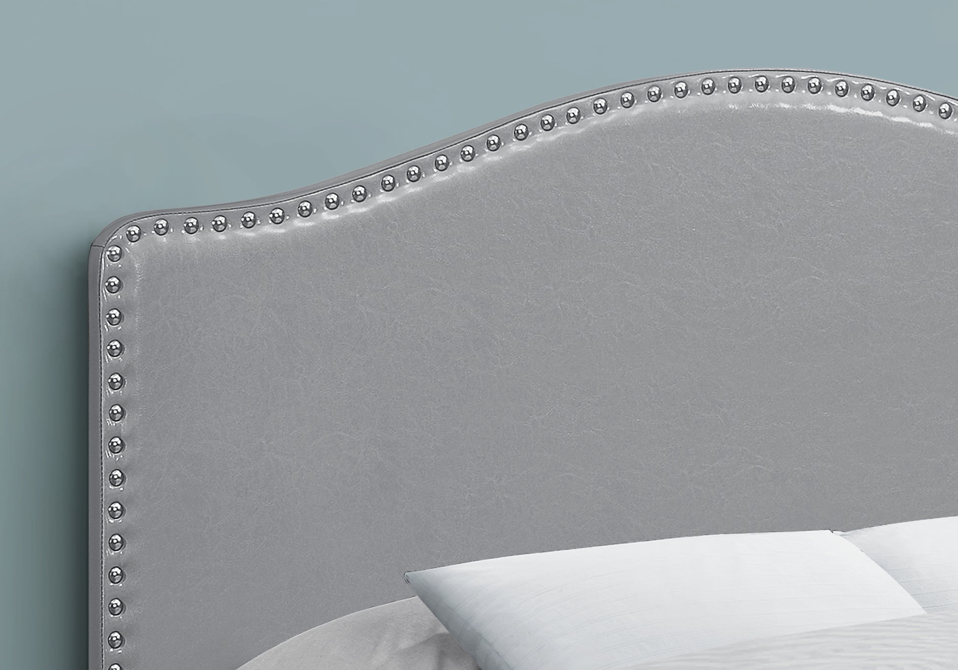 Grey faux leather headboard with silver nailhead trim elegant design for bedroom