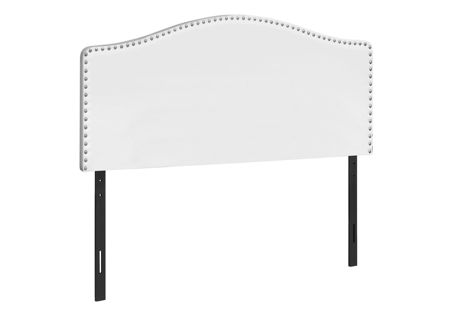 White upholstered arched headboard with silver nailhead trim detail