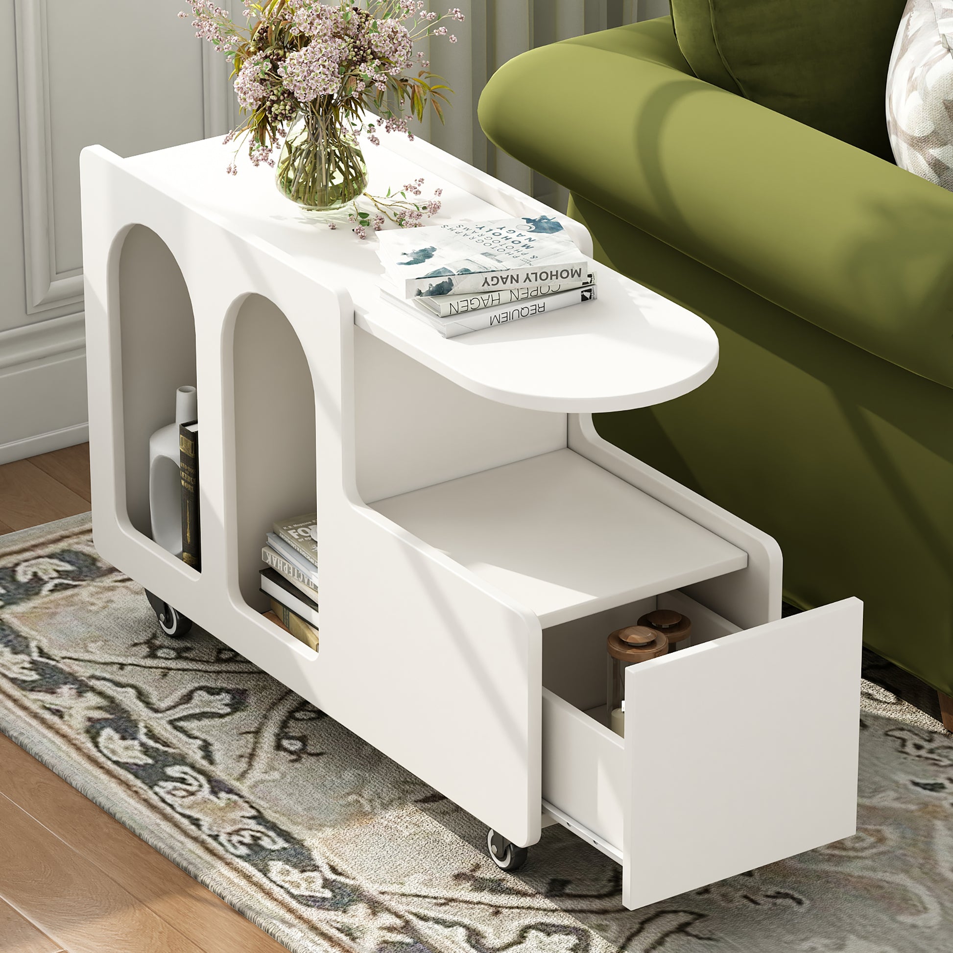 Modern white rolling bedside table with open shelves and a drawer