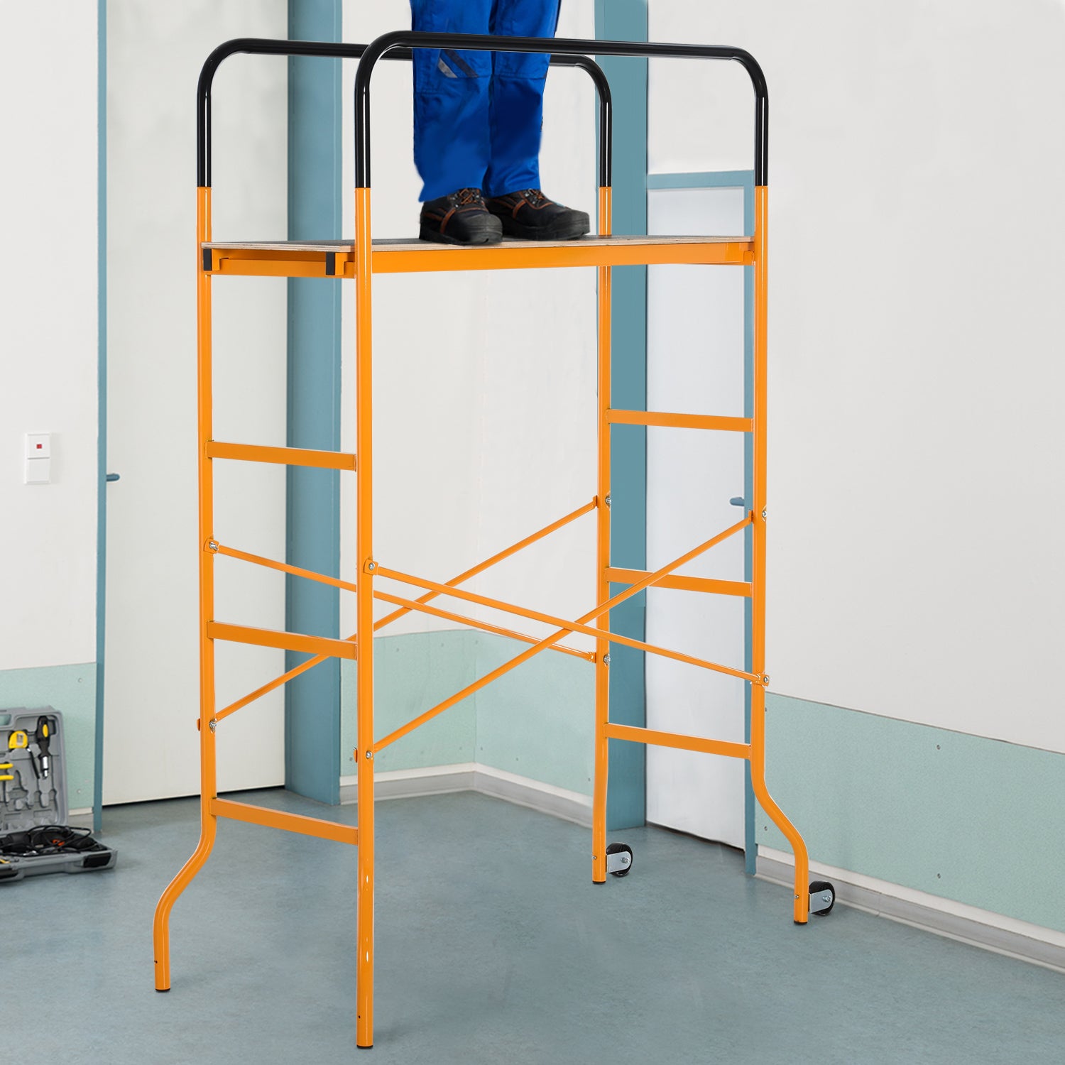 Orange portable scaffolding tower with safety rails and wheels for easy movement