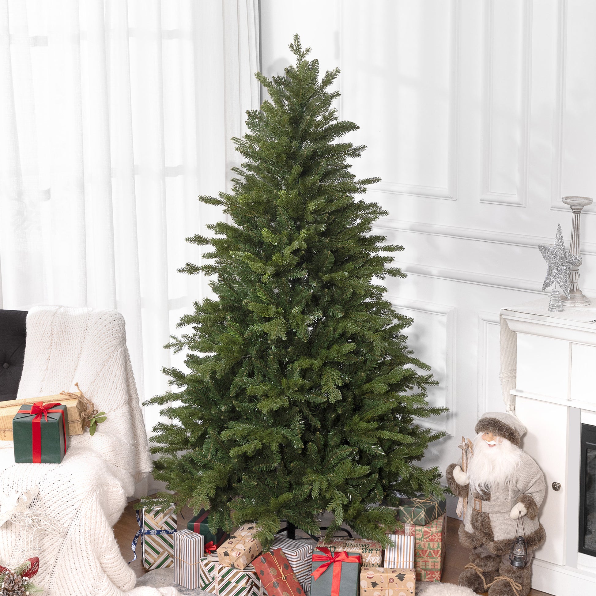 Full lush green artificial Christmas tree with many wrapped gifts at its base