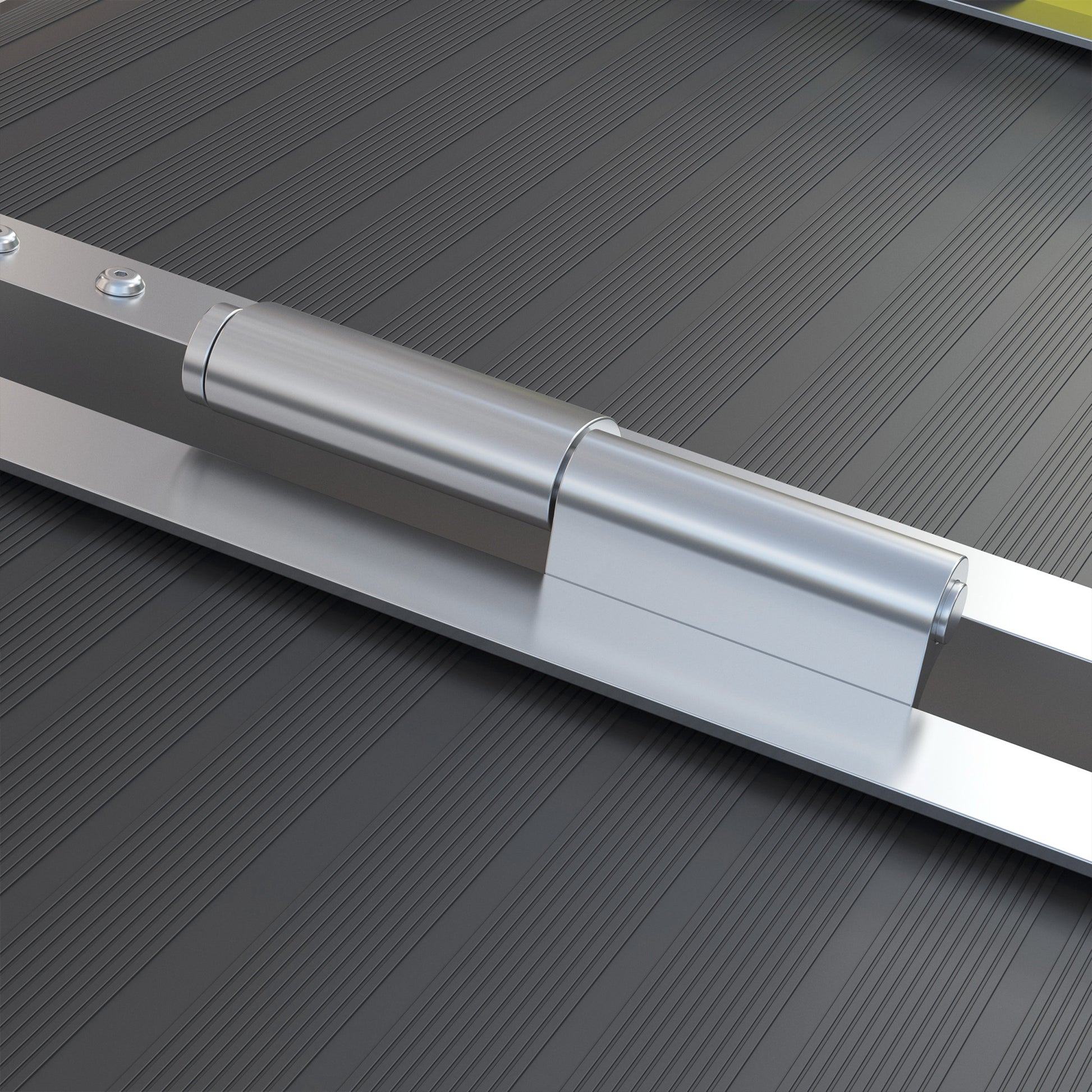 Closeup of a polished aluminum piano hinge on a ribbed dark gray surface
