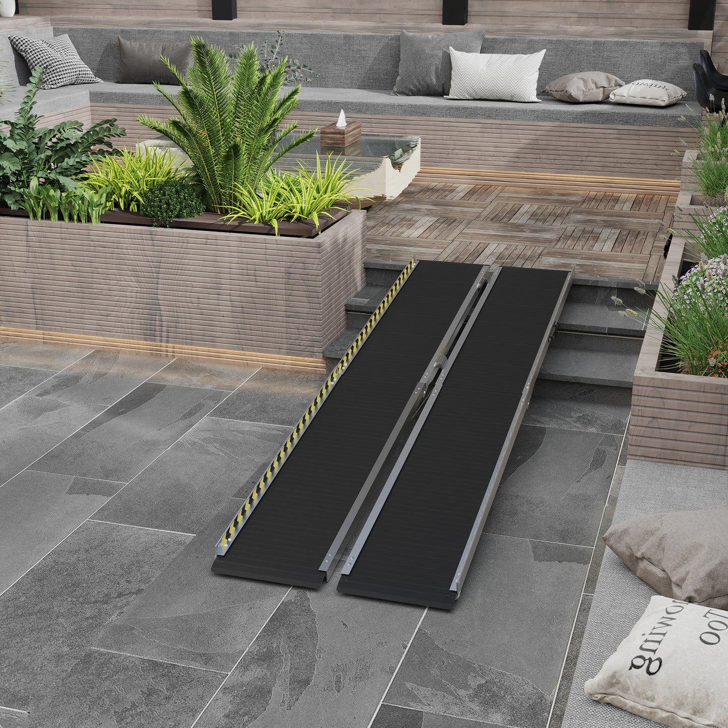 Silver and black portable wheelchair ramp with yellow safety markings for accessibility