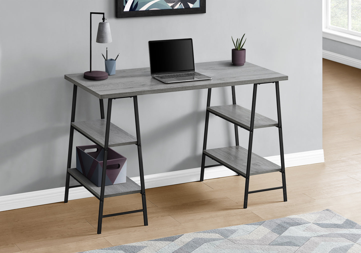 Gray wood desk with black frame and builtin shelving ideal for home office