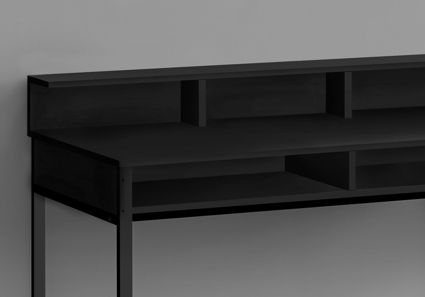 Black minimalist desk with open shelving and modern clean lines