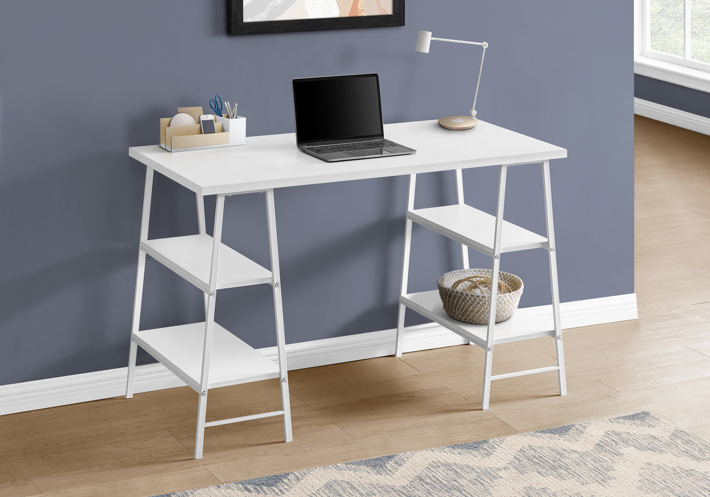 Modern white minimalist computer desk with integrated shelves and laptop
