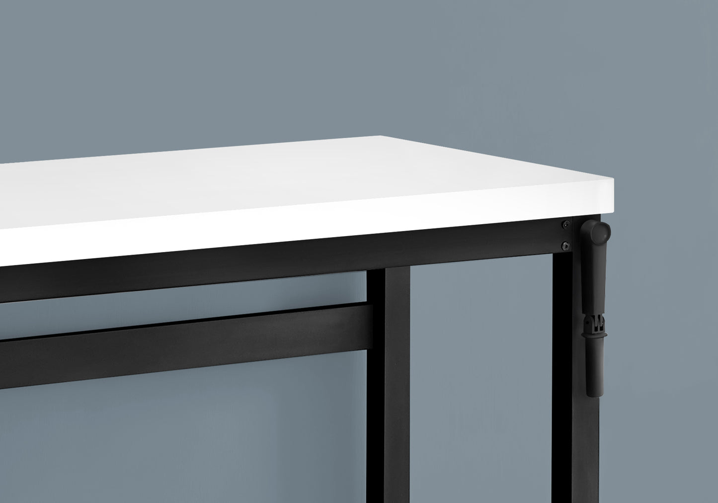 Modern white desk with a sleek black metal frame and adjustable height mechanism