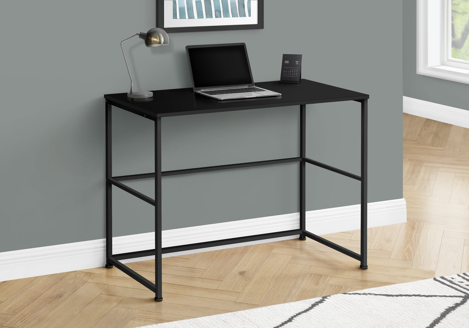 Modern black metal writing desk with open design and clean lines