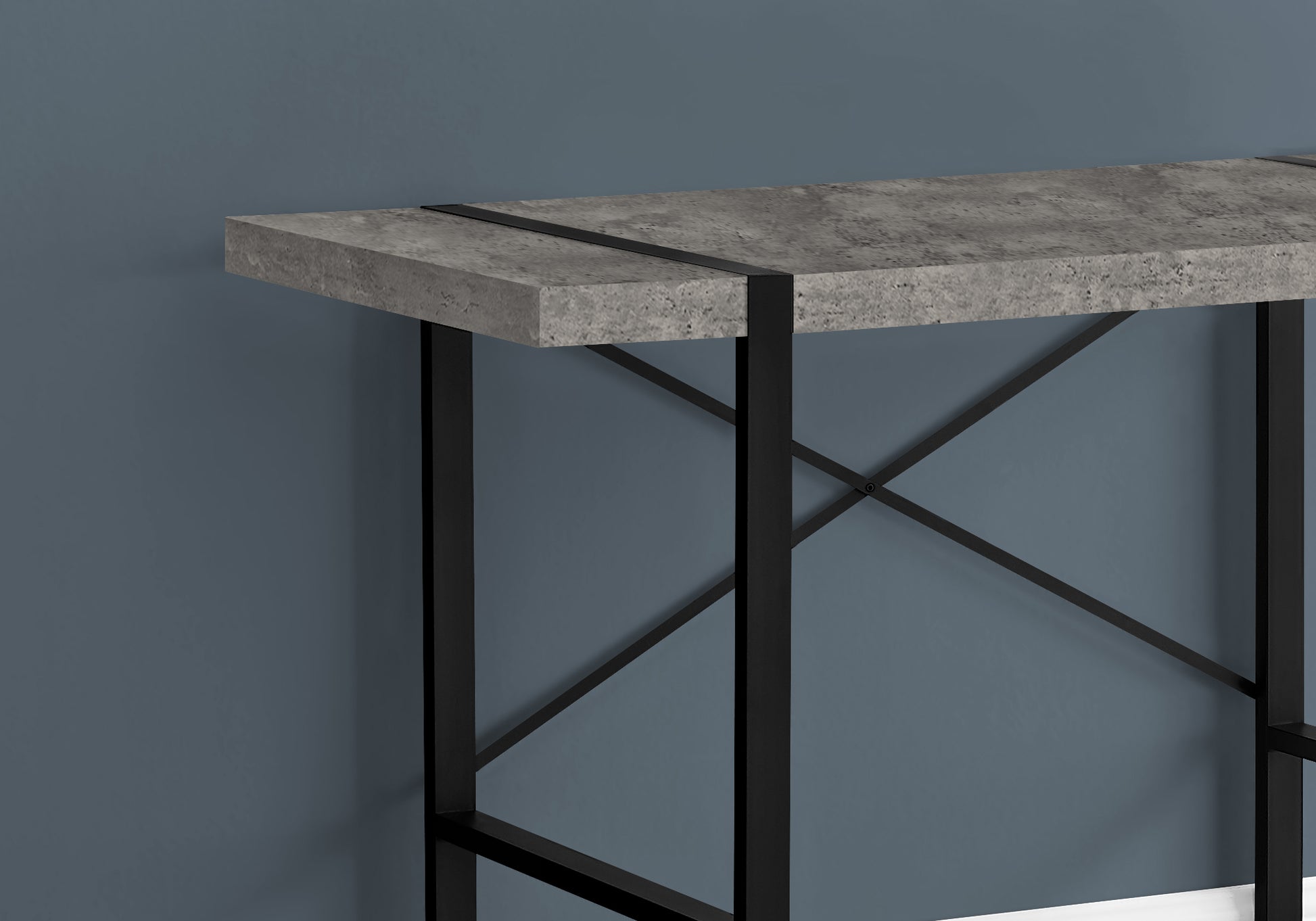 Concrete effect console table with black metal legs and cross bracing detail