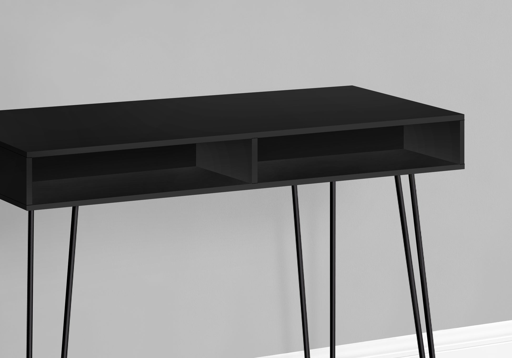 Sleek black console table with open shelving and hairpin legs