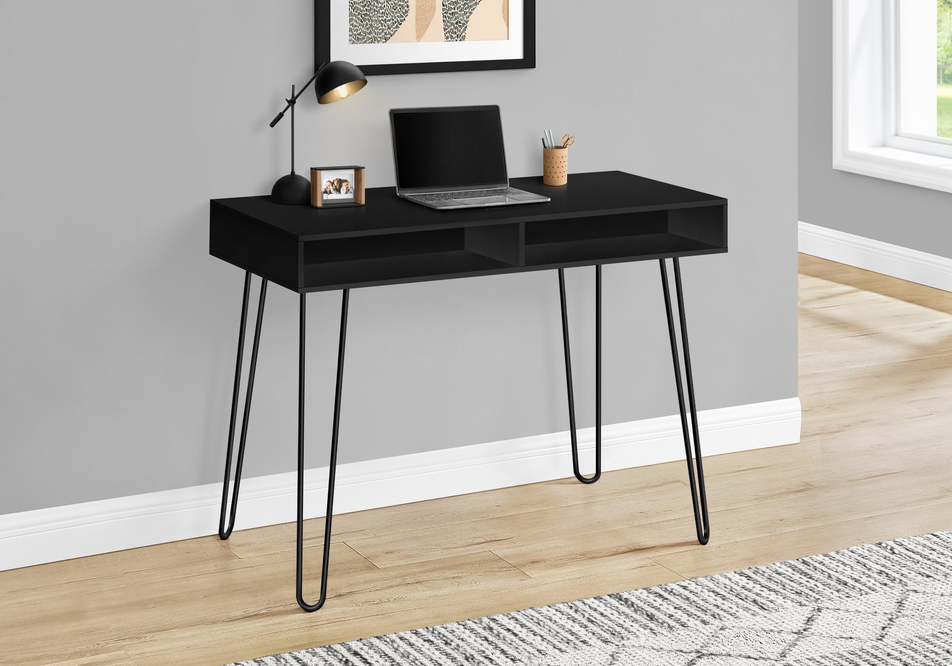 Sleek black modern desk with open shelving and hairpin legs