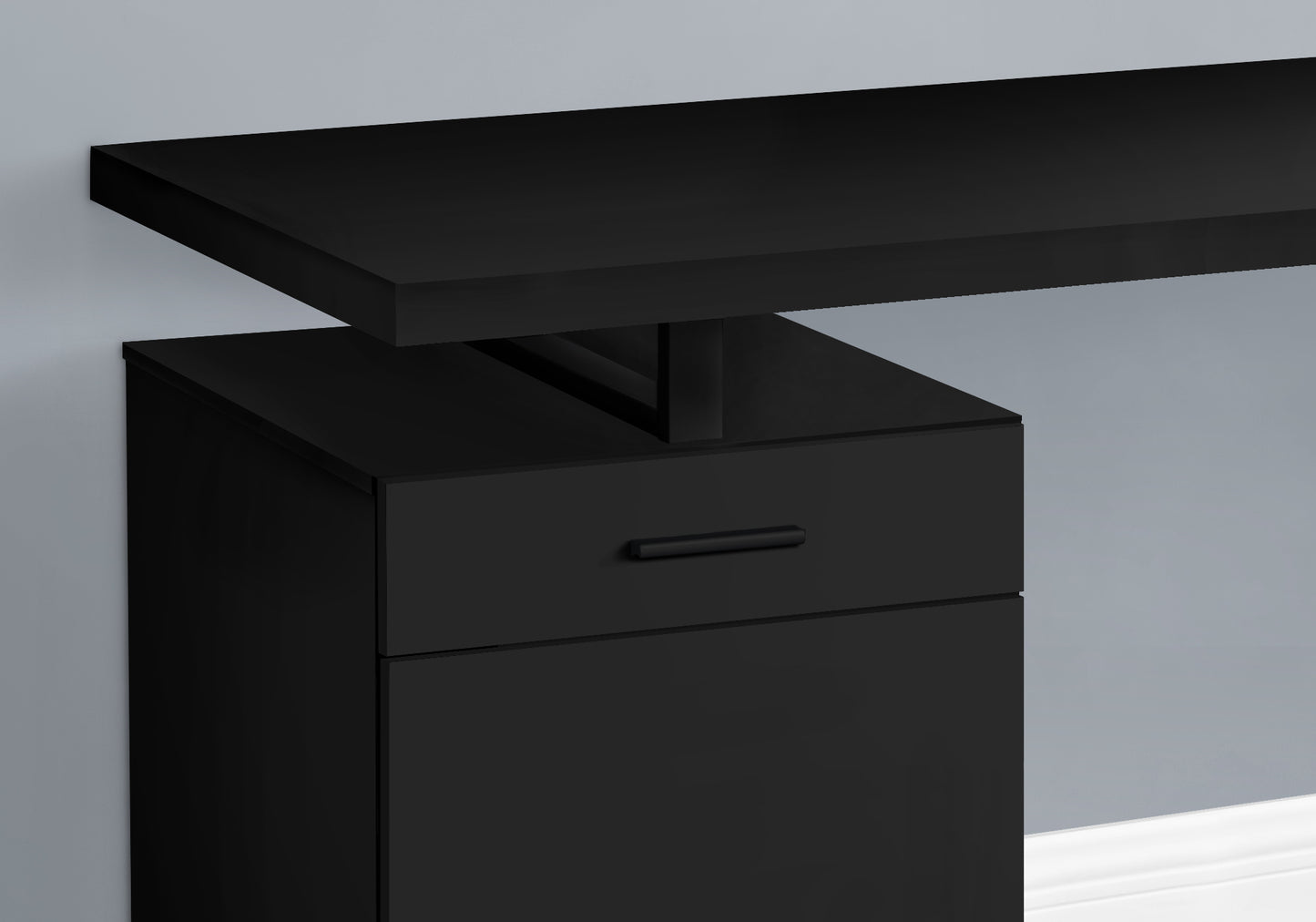 Sleek black modern desk with a single drawer and floating shelf design