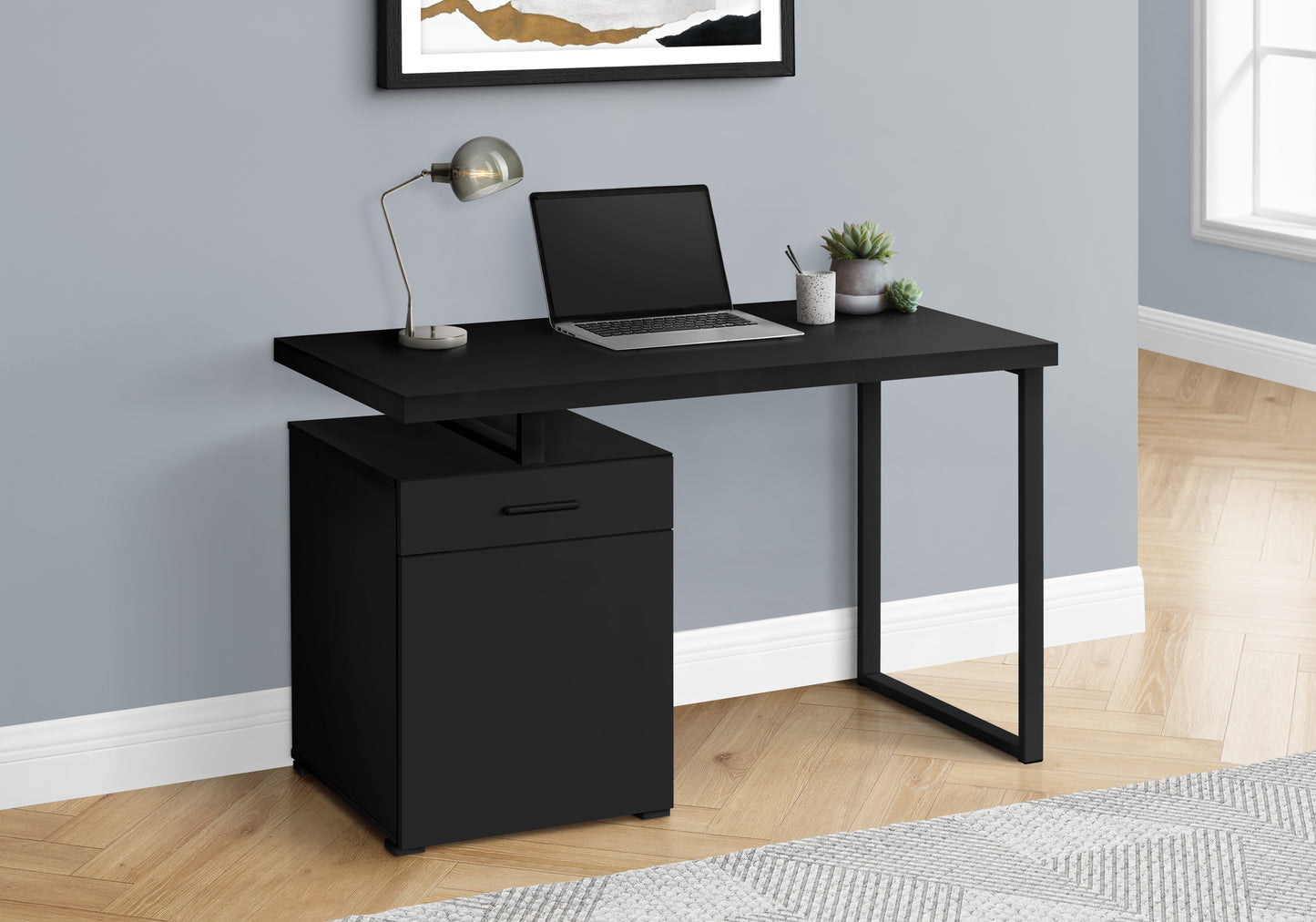 Modern black writing desk with integrated filing cabinet and metal frame perfect for home office