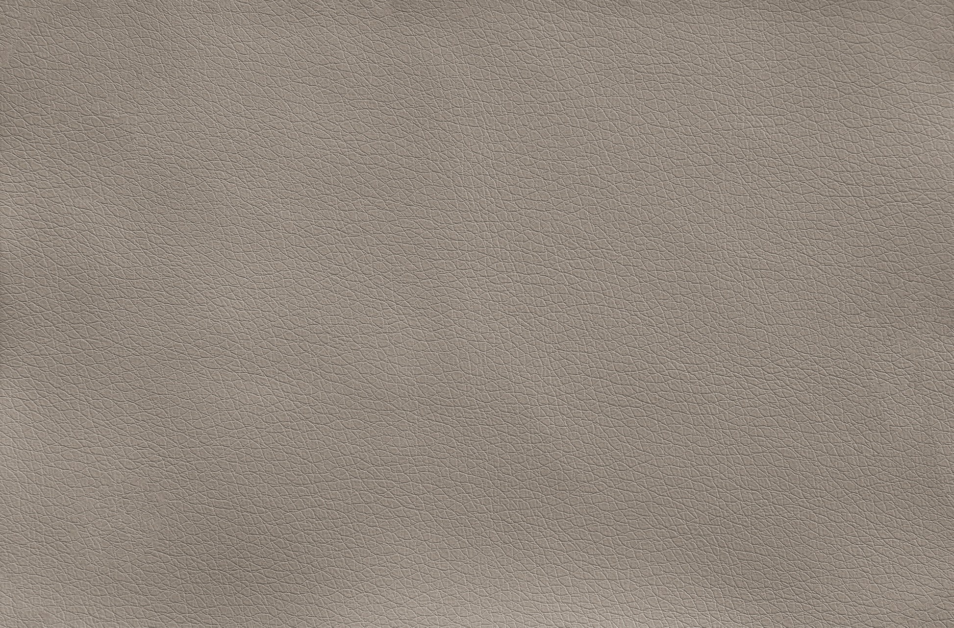 Closeup texture of taupe vegan leather upholstery for furniture