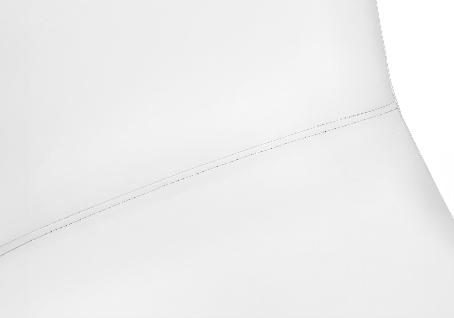 Closeup of white faux leather couch seam showcasing intricate stitching detail
