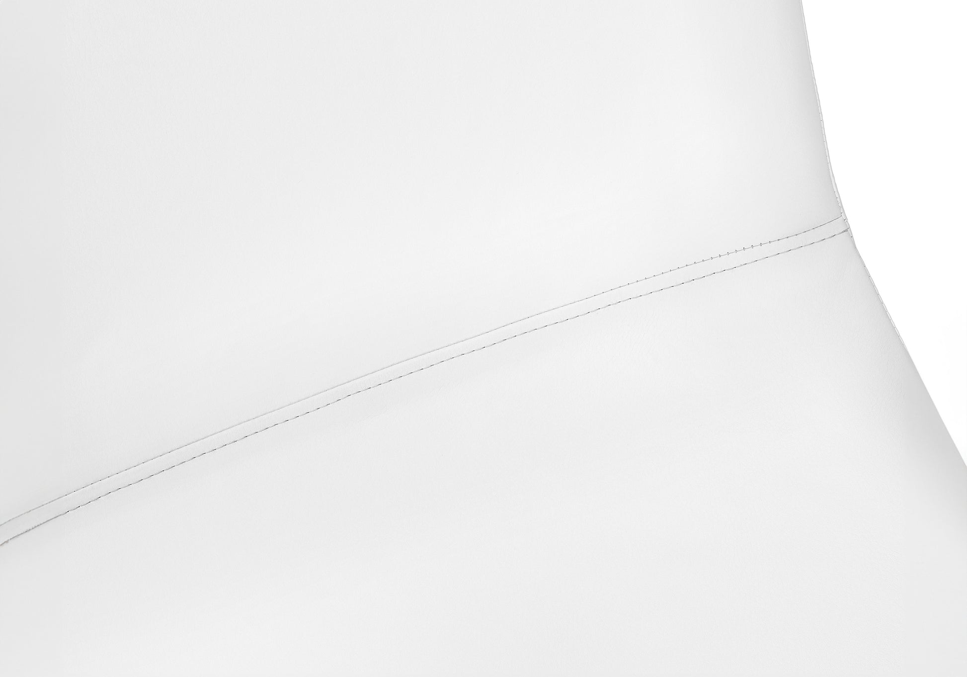 Closeup of white faux leather couch seam showcasing intricate stitching detail