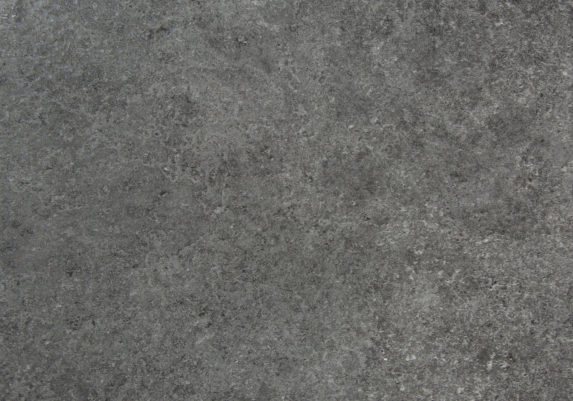 Dark grey concrete texture with subtle marbling for modern interior design