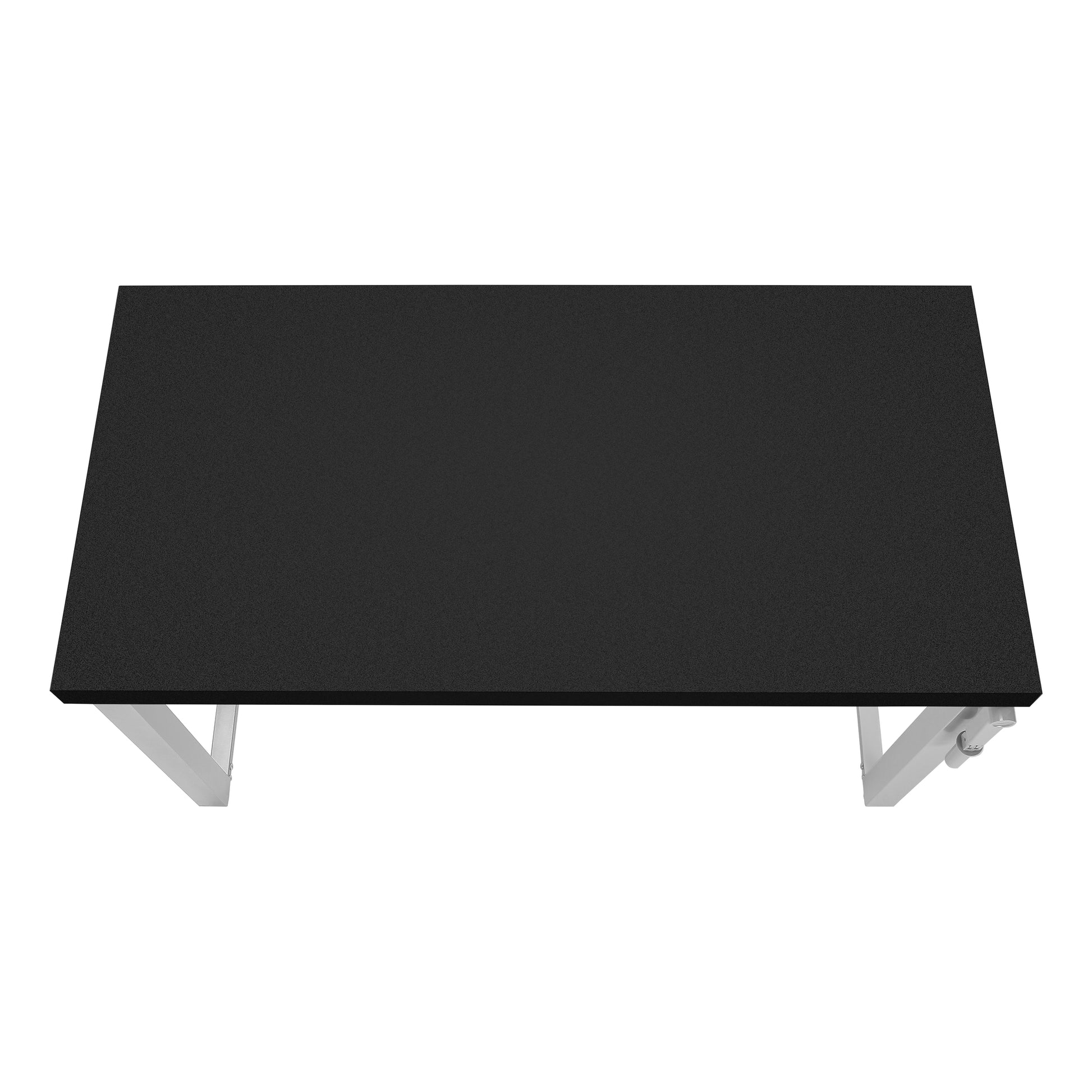 Black textured tabletop with minimalist silver legs ideal for a modern workspace