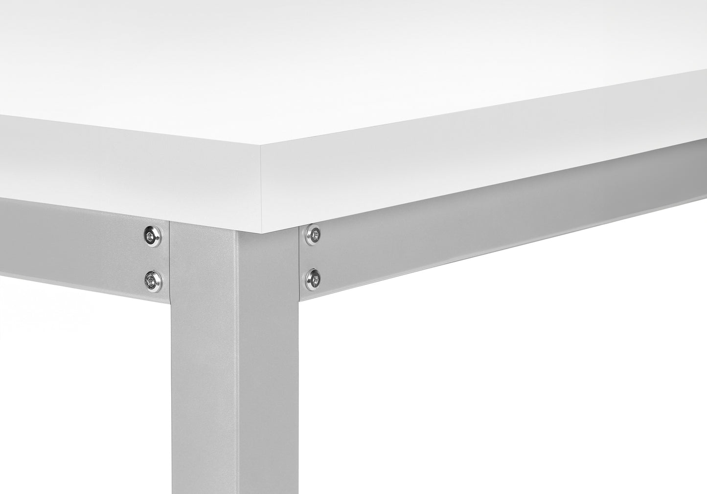 Closeup of a white desk with a silver metal leg and frame assembly