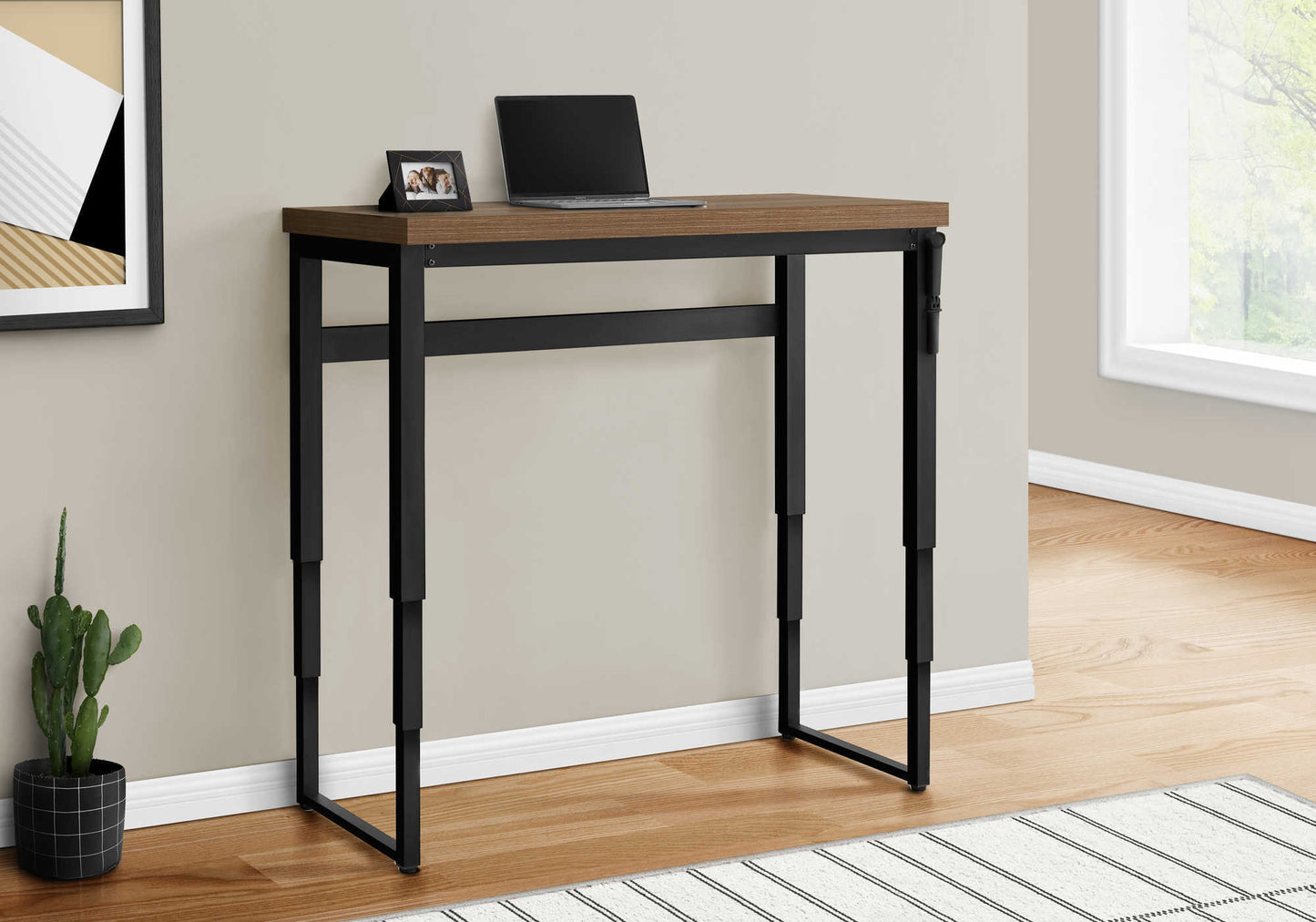 Compact wood top standing desk with black metal legs ideal for small spaces