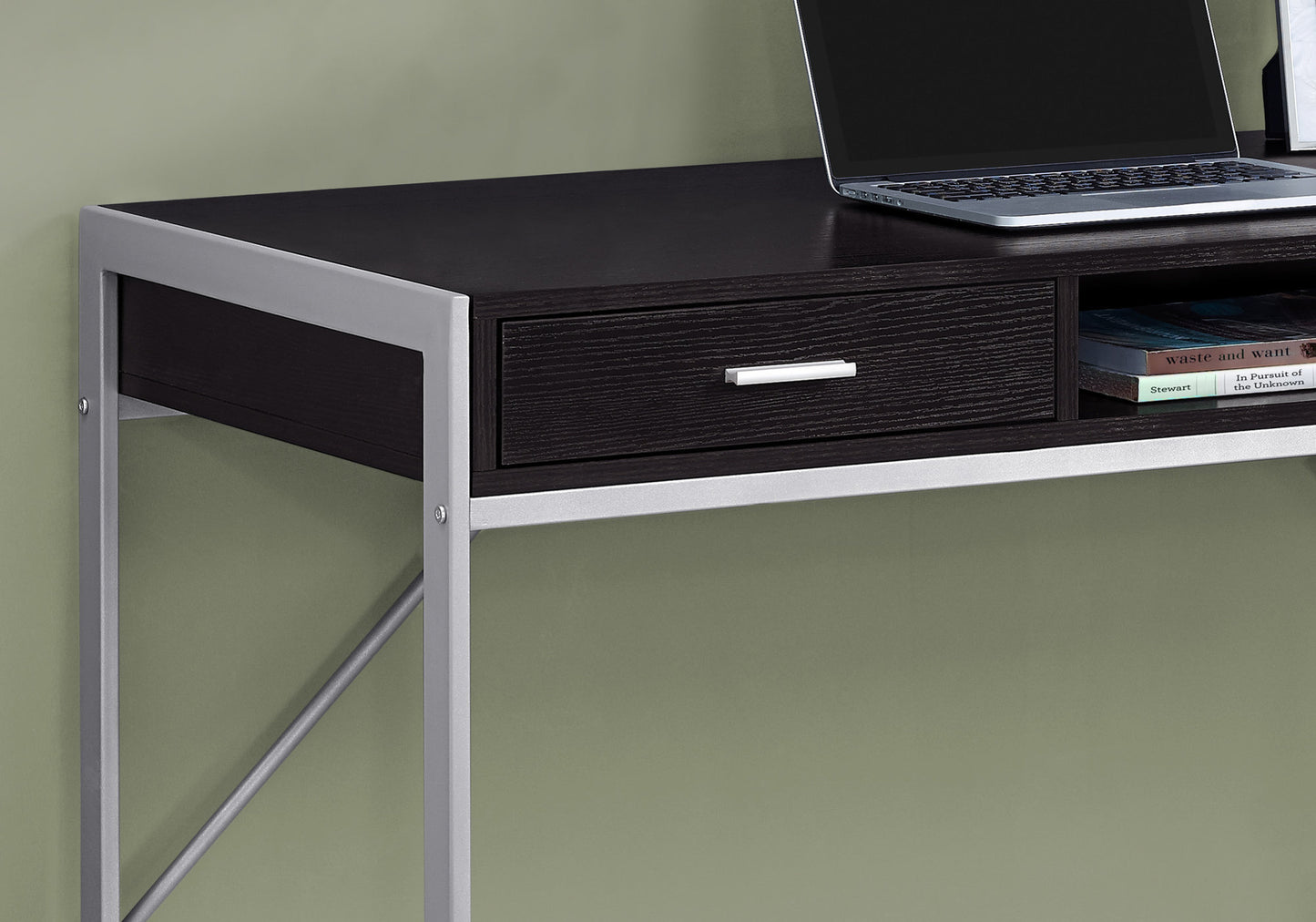 Dark wood and silver metal desk with drawer and open shelf laptop and books