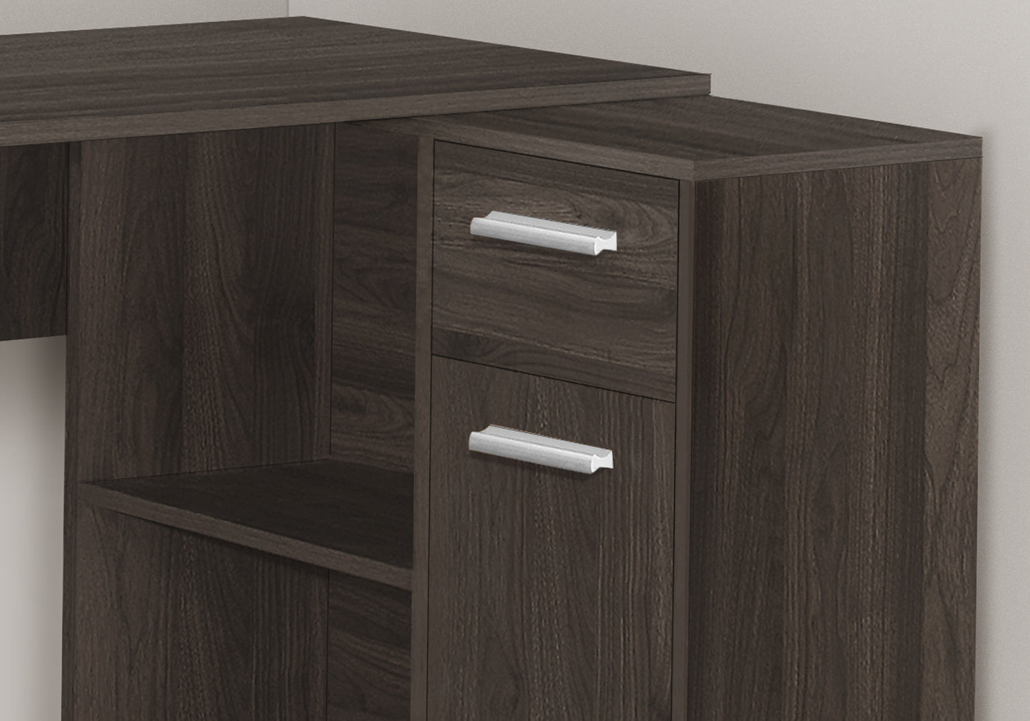 Dark wood corner desk with silver drawer pulls and open shelf